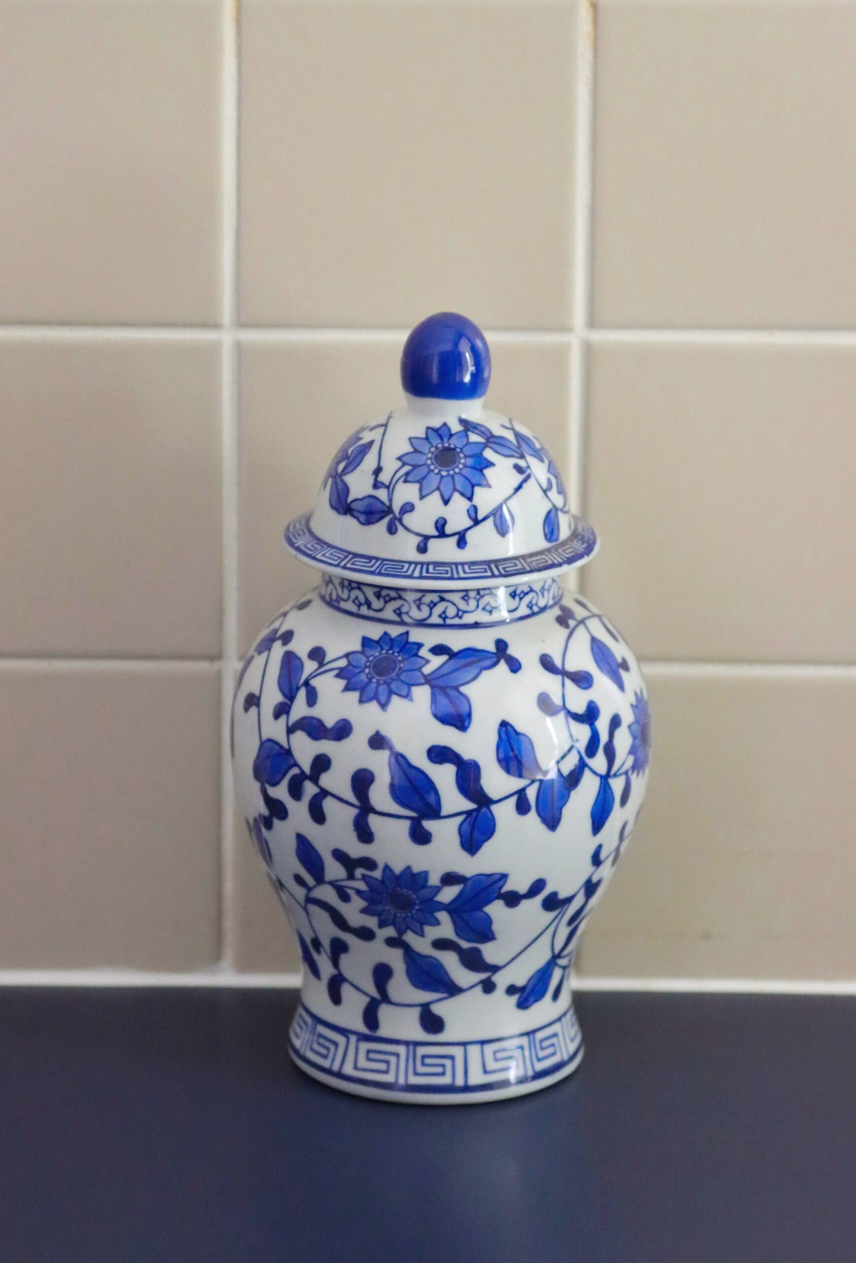 Blue and white ginger jar on a kitchen counter