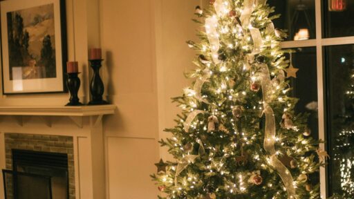Christmas tree glowing with warm white lights in a living room