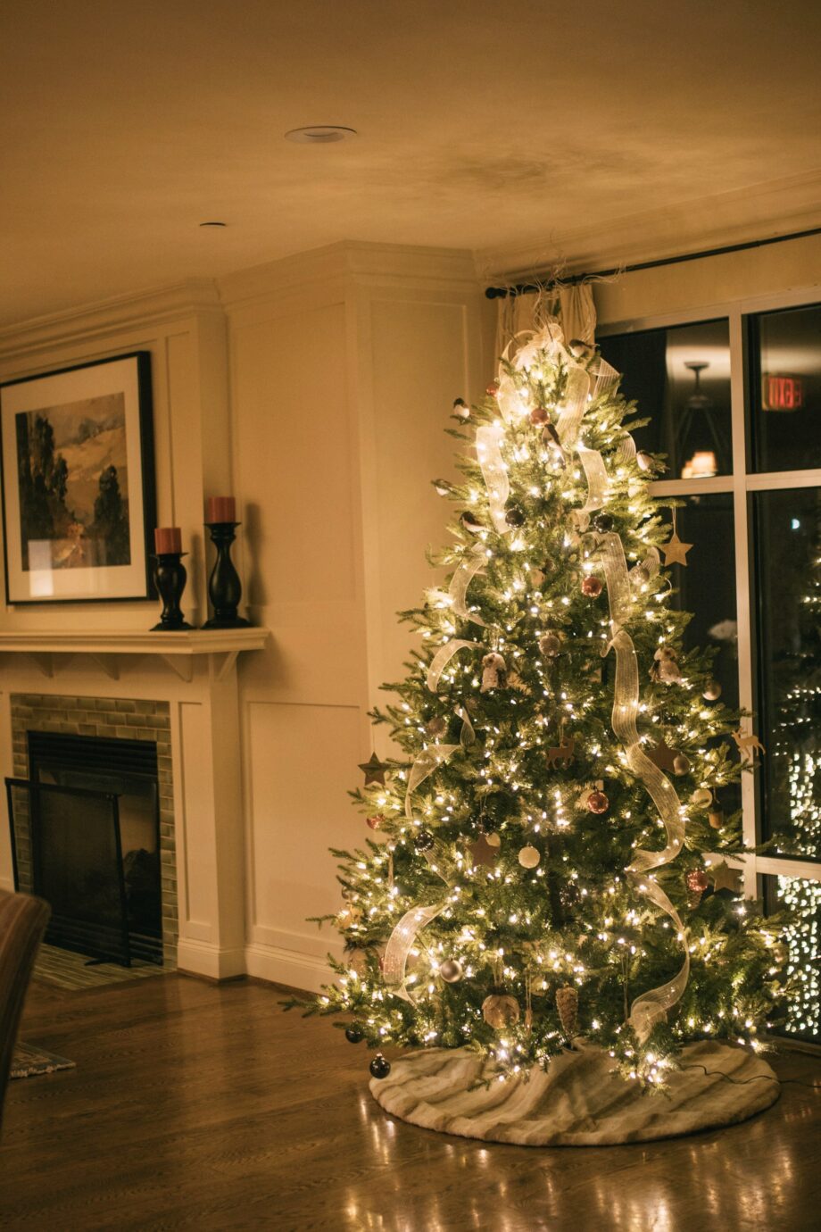Christmas tree glowing with warm white lights in a living room