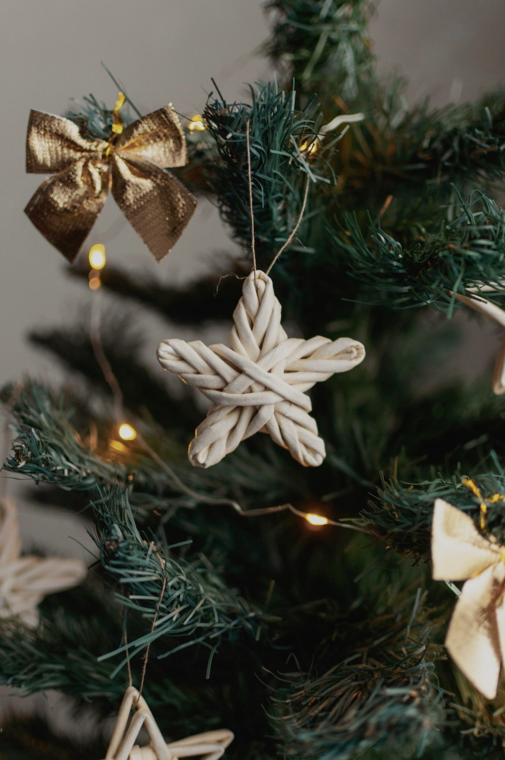 Woven natural stars hanging on a Christmas tree