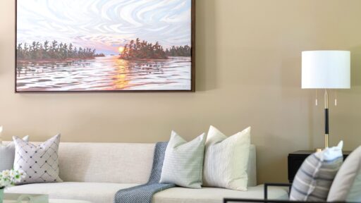 Living room with beach art hung above the sofa